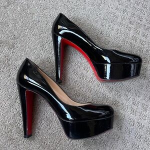 Louboutin black patent leather 4” heel.